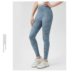 Detail shot of high-waisted blue tie-dye yoga pants with high-elastic compression fabric