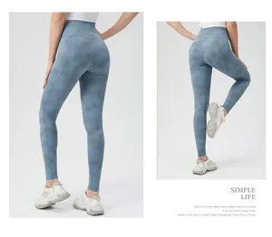 Detail view of high waisted tie dye yoga leggings in blue grey cloud pattern fabric