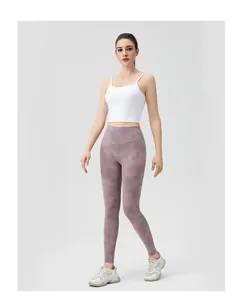 Full view of high waist purple tie-dye yoga leggings with a white cropped sports tank top