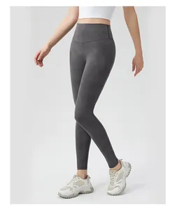Close-up of high-waisted dark grey yoga leggings showing the elastic squat-proof fabric