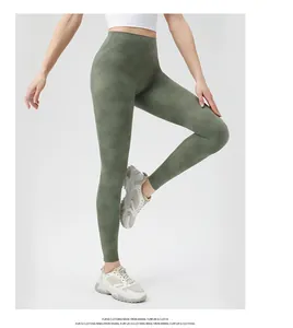 Side view of dark green camouflage yoga pants featuring a high-waisted seamless design