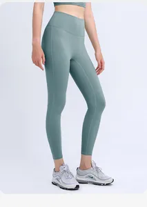 Detail of high-waist yoga leggings in sage green with seamless compression fabric