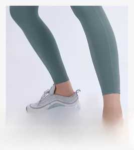Detail view of high-waist yoga pants ankle cuff showing elastic fabric and seam quality