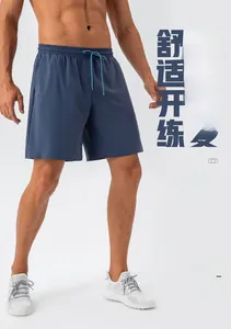 Close-up of quick-dry navy blue sports shorts showing elastic waist and drawstring detail