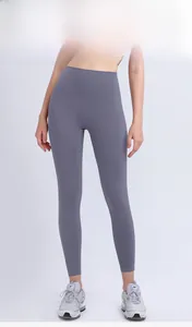 Front view of high waisted seamless yoga leggings in dark mauve for fitness training