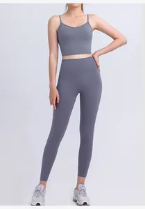 Detail view of charcoal gray high-waisted yoga leggings and V-neck sports bra set