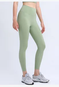Close-up of mint green high waist yoga leggings with flatlock stitching details
