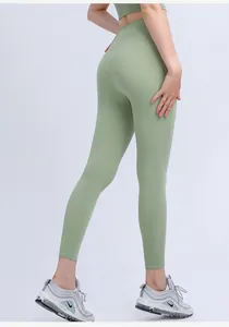 Detailed back view of high-waist mint green yoga pants showing body-sculpting fit