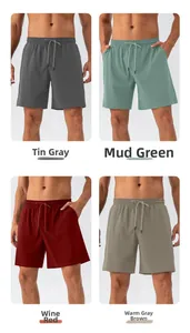 Detailed comparison of quick-dry sports shorts in tin ore gray, green, red, and brown