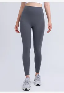 Detail view of high-waisted seamless waistband on dark grey compression yoga pants