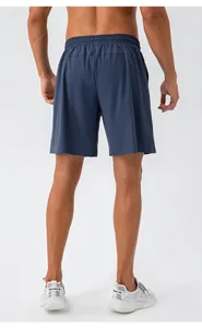 Rear view of men's quick-dry navy blue sports shorts with elastic waistband detail