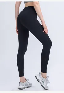 Close-up of high-waisted black yoga pants showing butt-lifting effect and stretchy fabric