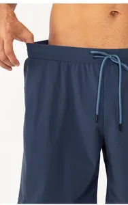 Detail of navy blue quick-dry shorts featuring an elastic waistband and drawstring
