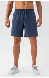 Men's quick-dry sports shorts in blue-grey with elastic waistband and drawstring detail