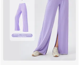 Detail of high-waisted loose light purple yoga pants with side split hem for women