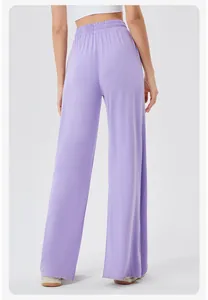 Back view of high-waisted wide-leg yoga pants in lavender with elastic waist detail