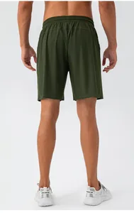 Rear view of olive green quick-dry sports shorts with breathable fabric and elastic waist