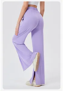 Detail view of purple high-waisted wide-leg yoga pants with a stylish side slit design