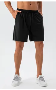 Detail of lightweight breathable men's black sports shorts with drawstring waistband