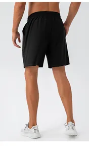 Close-up of black quick-dry sports shorts featuring an elastic waistband and side pockets