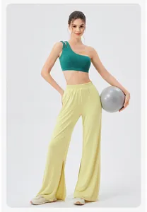 Deep green one-shoulder sports bra with yellow high-waisted split wide-leg pants