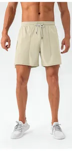 Close-up of men's quick-dry sports shorts with elastic drawstring waist in beige