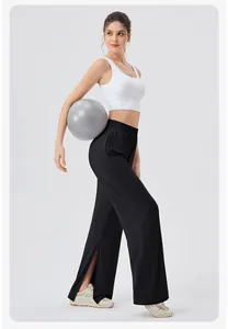 Close-up of black high-waisted yoga pants featuring side slits and wide elastic waistband