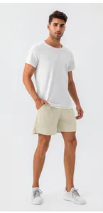 Men's summer quick-dry athletic shorts with white T-shirt and grey sneakers look