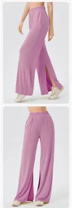 Detailed view of high-waist yoga pants with side slits in a soft purple breathable fabric