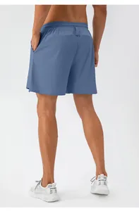 Rear view of men's loose blue sports shorts showing lightweight quick-dry fabric texture