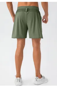 Rear view of olive green quick-dry sports shorts showing elastic waistband and back loop detail