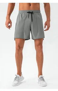 Detailed shot of men's quick-dry sports shorts showing elastic drawstring and seam design