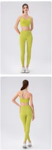 Detail view of lime green sports bra with thin white criss-cross back straps and yoga leggings