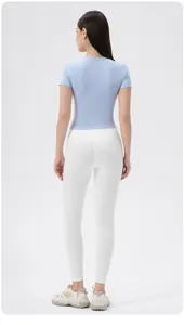 Back view of slim fit yoga T-shirt and high waist leggings for women's fitness
