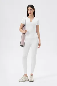 Detailed full body shot of white yoga set with zip-front short sleeve top and leggings