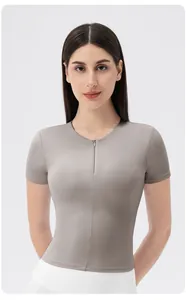 Detail of taupe yoga top with invisible zipper and high-stretch functional fabric
