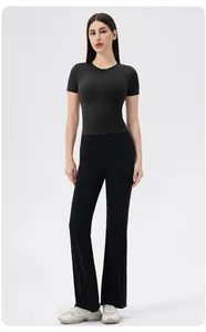 Close-up of black high-elastic yoga top with front zipper and matching flared leggings