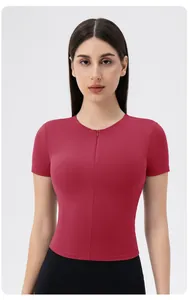 Detail showing the front zipper and slim fit rose red short sleeve yoga t-shirt