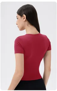 Slim fit burgundy yoga top with full back view showing stretch fabric and sleek seams