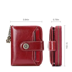 Dark red faux leather women's short wallet with sunflower clasp and clover charm detail