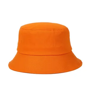 Detailed view of an orange cotton bucket hat featuring rows of parallel brim stitching