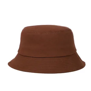 Detailed view of dark brown cotton bucket hat with parallel stitching on the brim