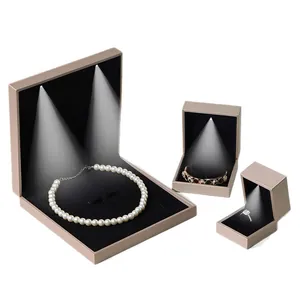 Luxury champagne gold LED jewelry boxes with black velvet lining for rings and necklaces