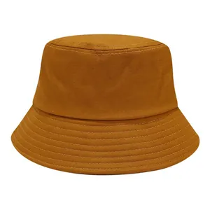 Detailed view of mustard yellow cotton bucket hat with reinforced multi-row stitched brim