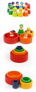 Detailansicht der bunten Montessori Holzpuppen und stapelbaren Regenbogen-Nestschälen