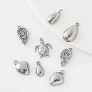 DIY stainless steel pendants in vintage silver, featuring turtle and heart-shaped designs