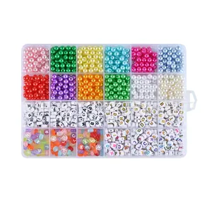Detailed view of 24-grid organizer box with colorful pearls and letter beads for DIY jewelry