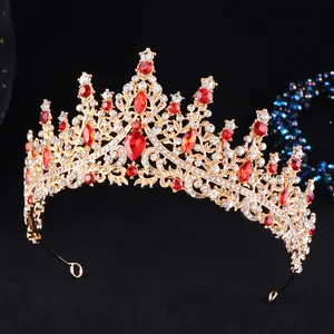 Macro view of golden crown details featuring red rhinestones and intricate alloy engraving