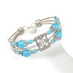 Bohemian multi-layer silver alloy bracelet with blue turquoise beads and hollow floral patterns
