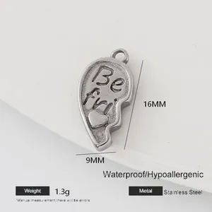 Macro detail of half-heart puzzle charm in stainless steel with size and weight specs